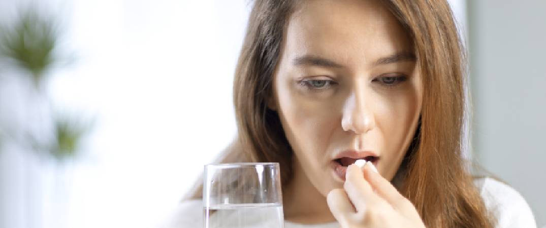 woman taking tablet_summary.jpg