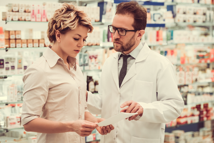 Pharmacist talk with woman.png